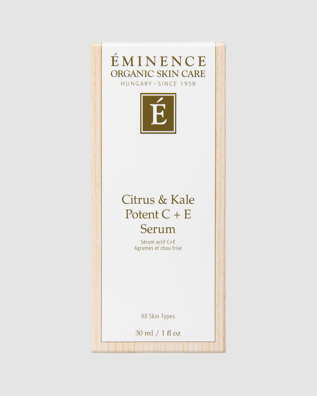 Eminence Organic Skin Care Citrus & Kale Potent C + E Serum packaging on a light gray background