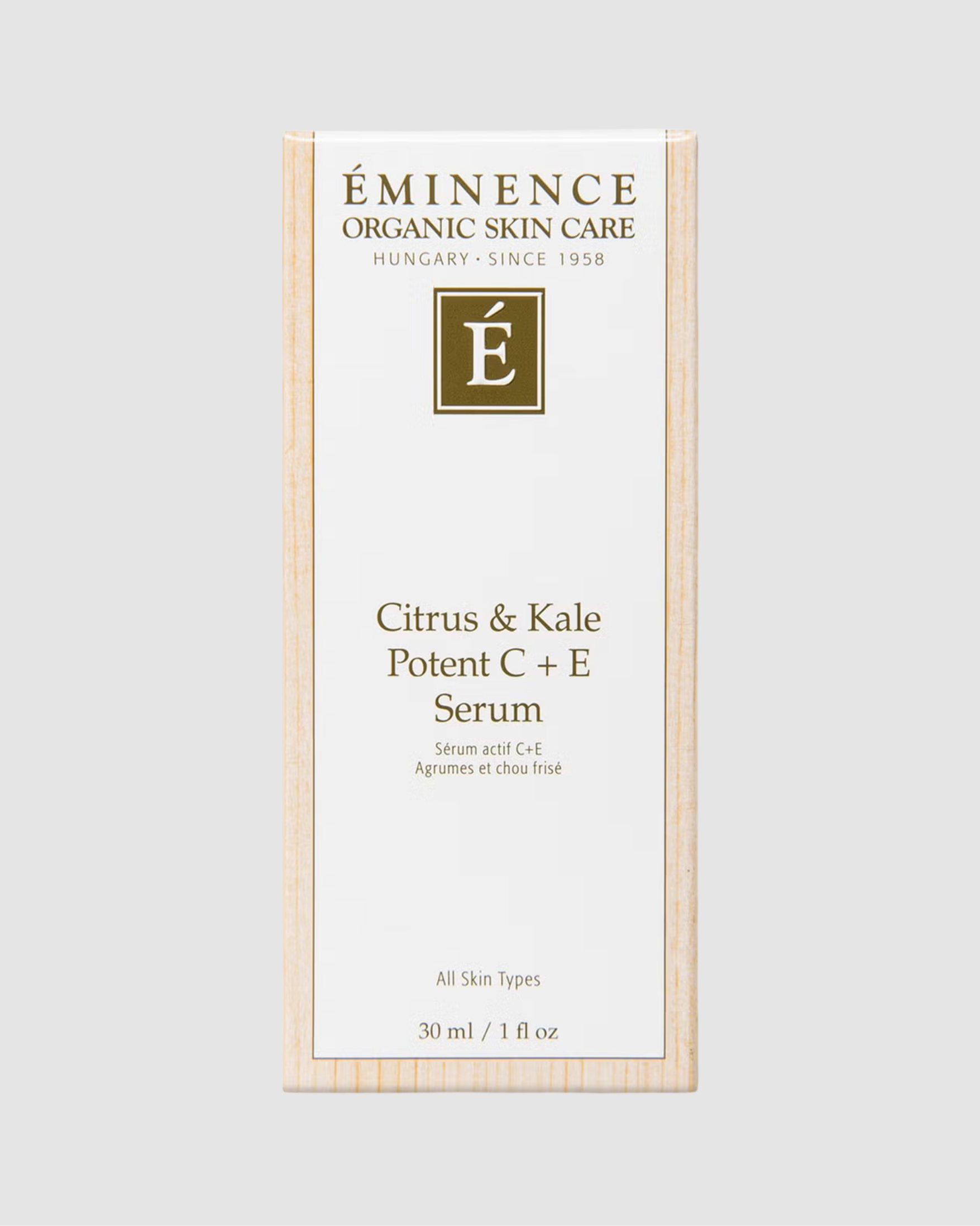 Eminence Organic Skin Care Citrus & Kale Potent C + E Serum packaging on a light gray background