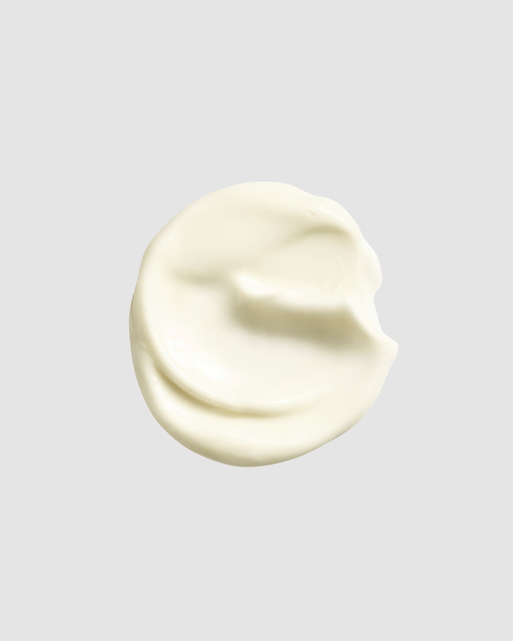 Creamy white substance on a gray background