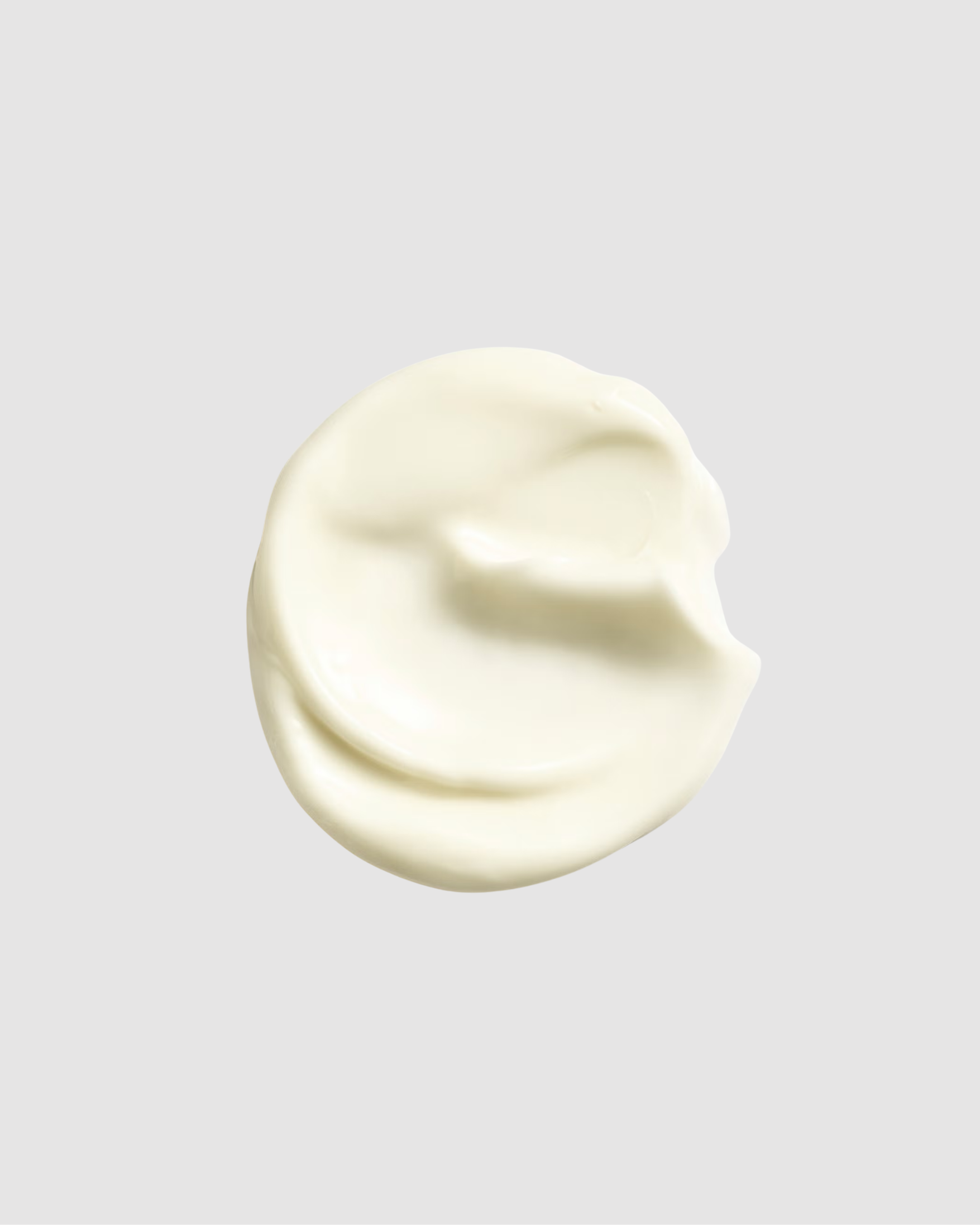 Creamy white substance on a gray background