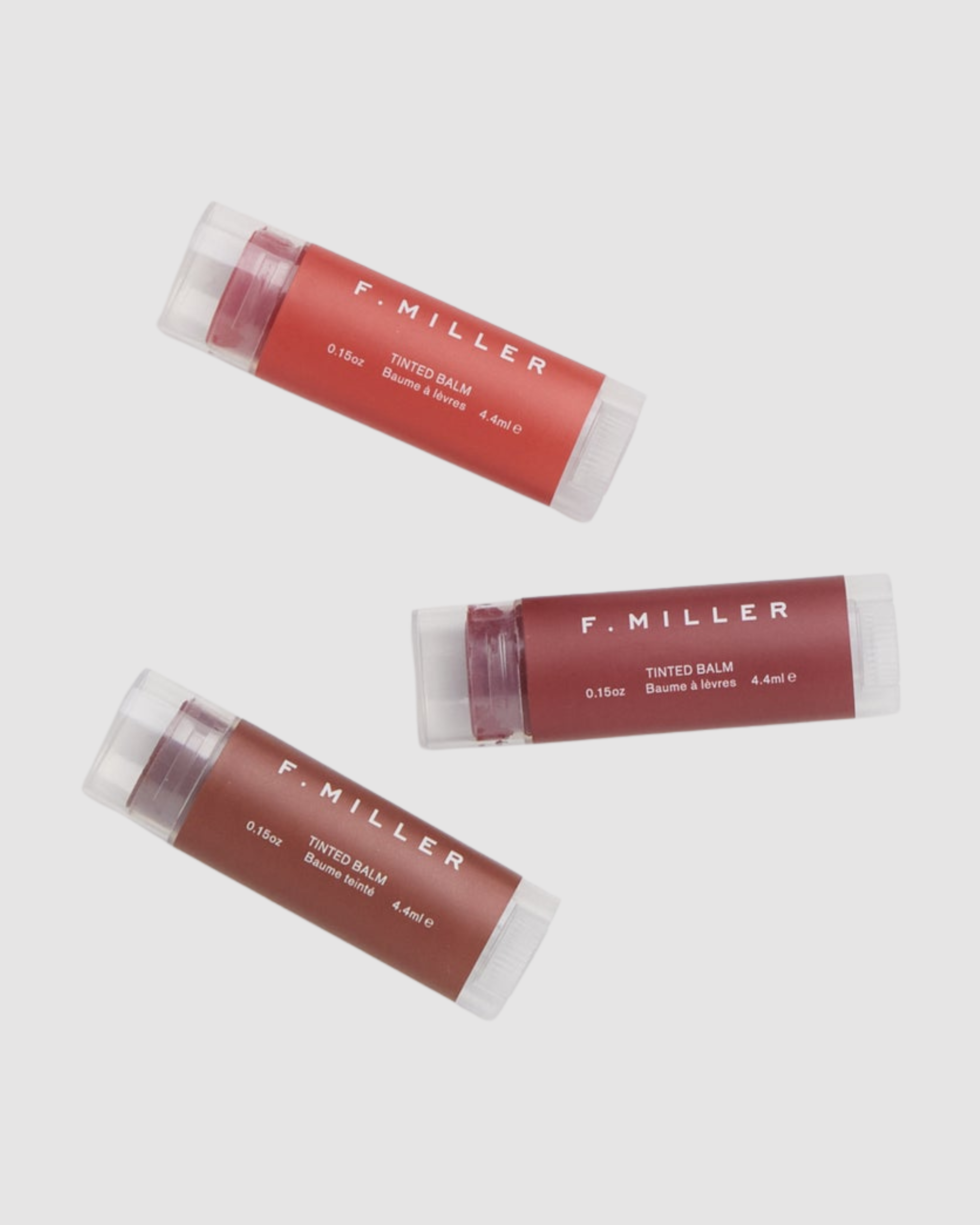 Three F. Miller tinted balms on a white background