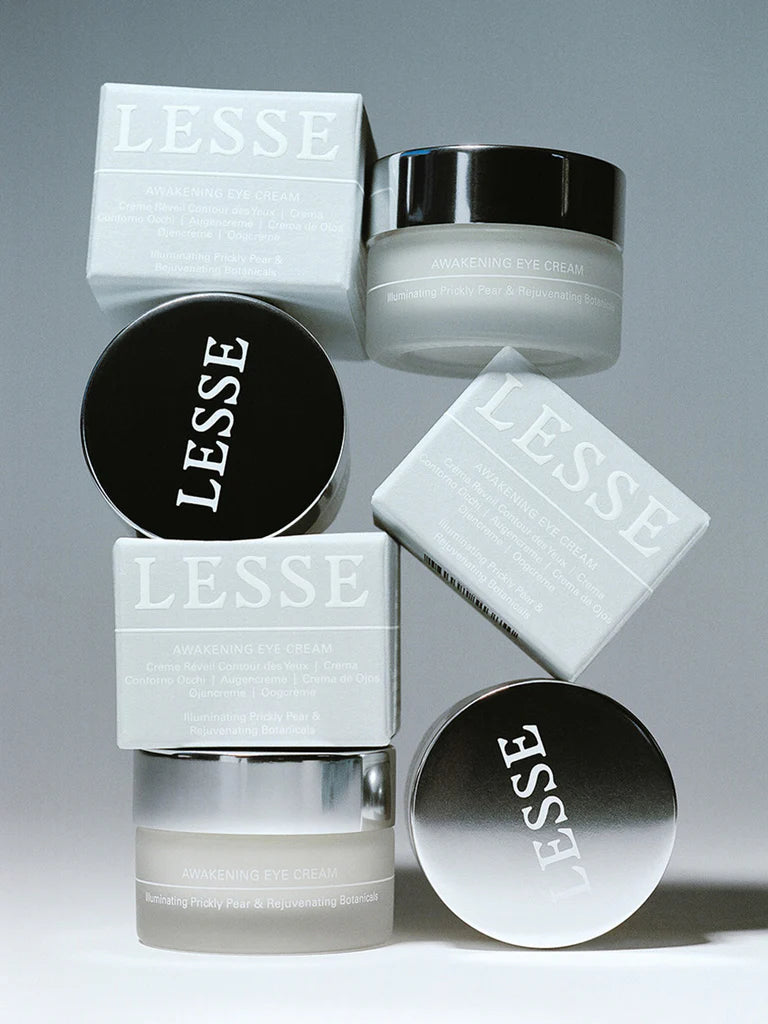 Cosmetic products with 'LESSE' branding on a gray background