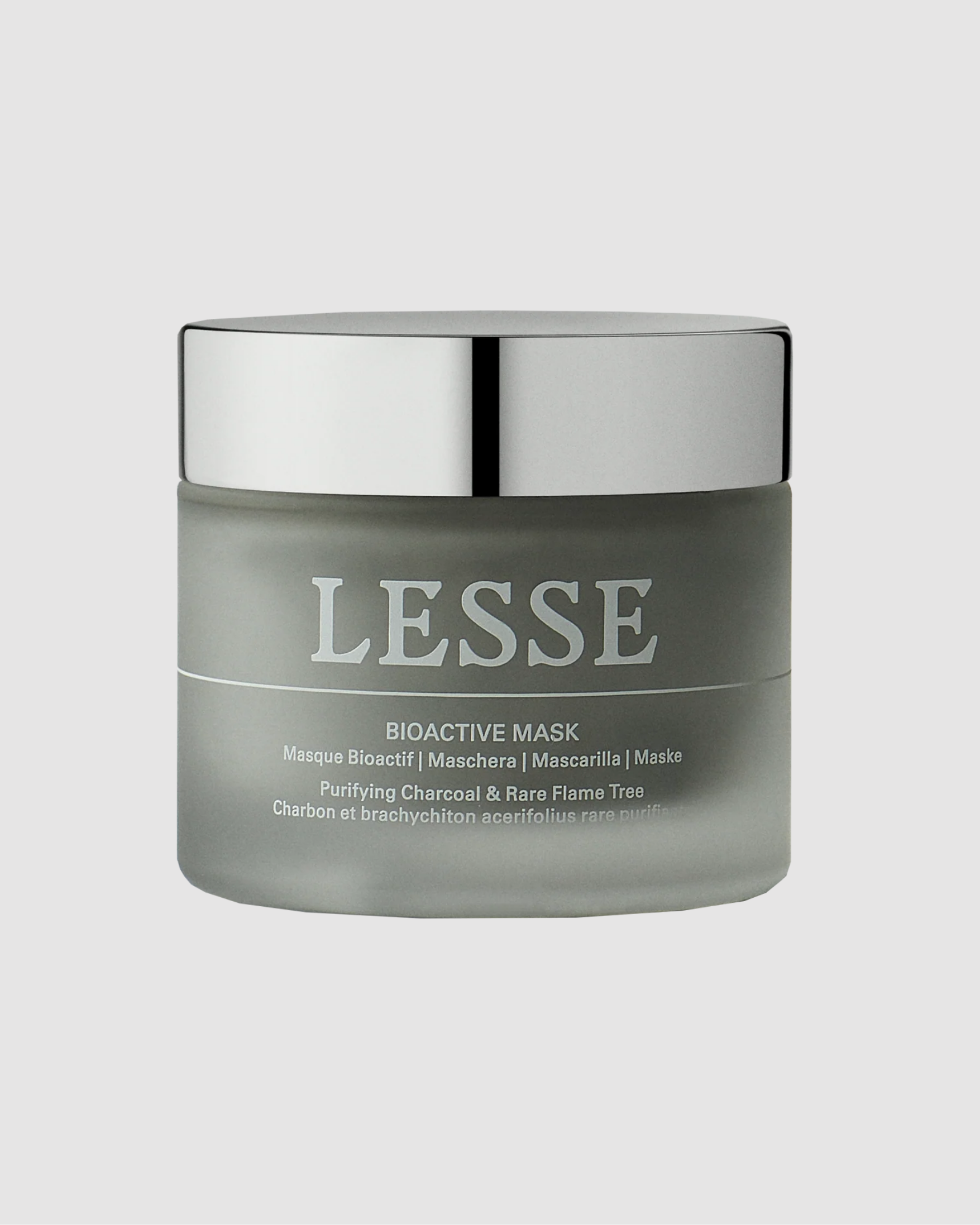 Gray jar of LESSE bioactive mask with silver lid on a light gray background