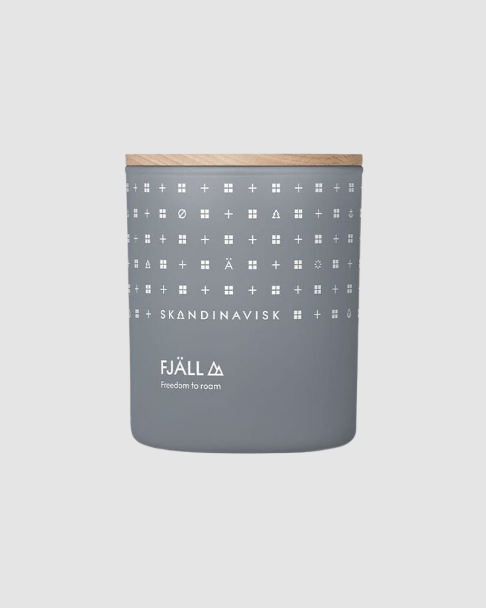 Gray candle with geometric pattern and wooden lid on a white background