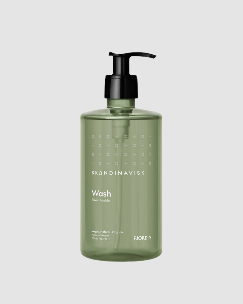 Green bottle of Skandinavisk Wash on a light gray background