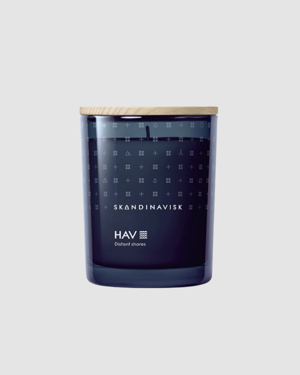 Skandinavisk candle with geometric pattern on a light gray background