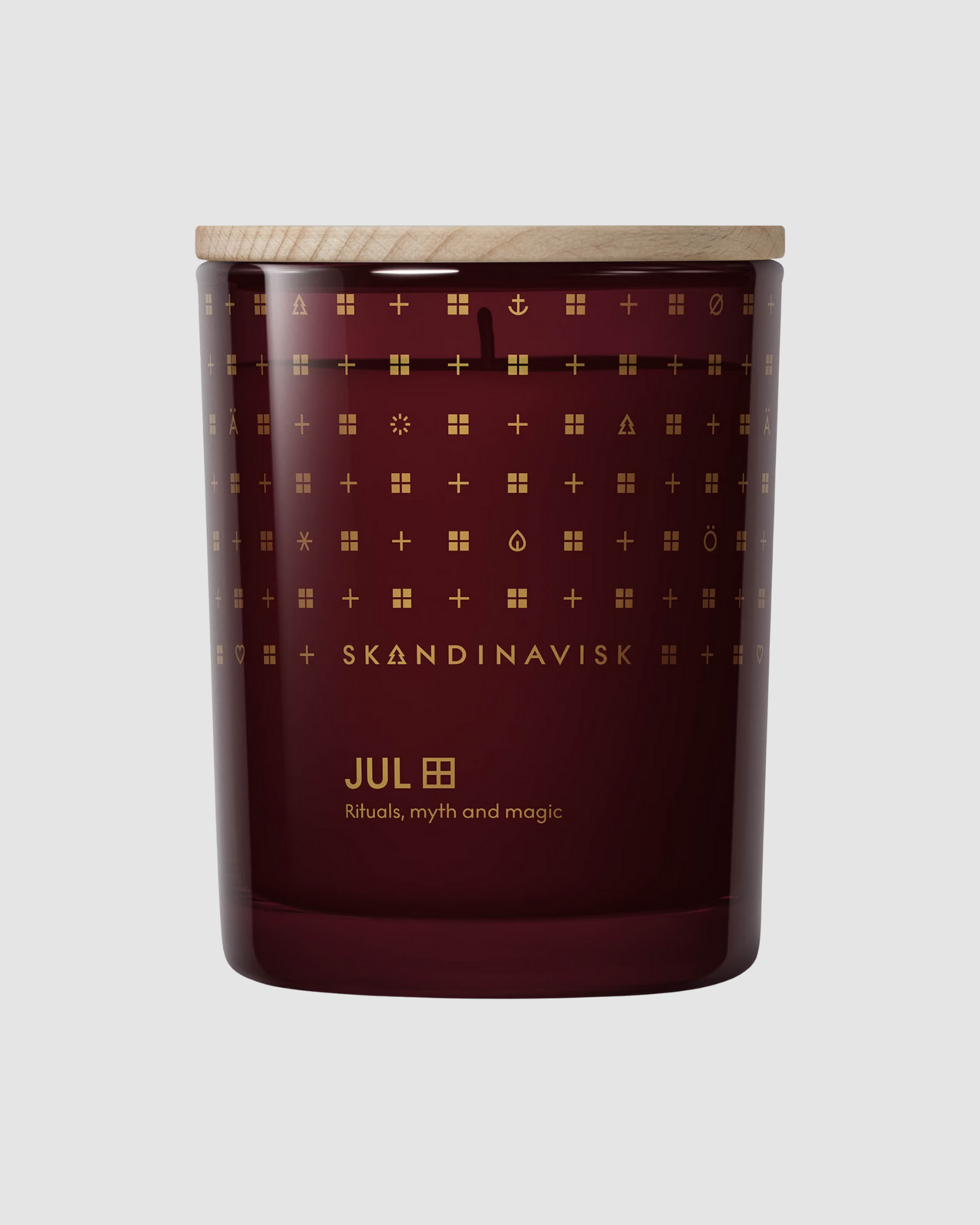 Skandinavisk candle with decorative pattern on a gray background