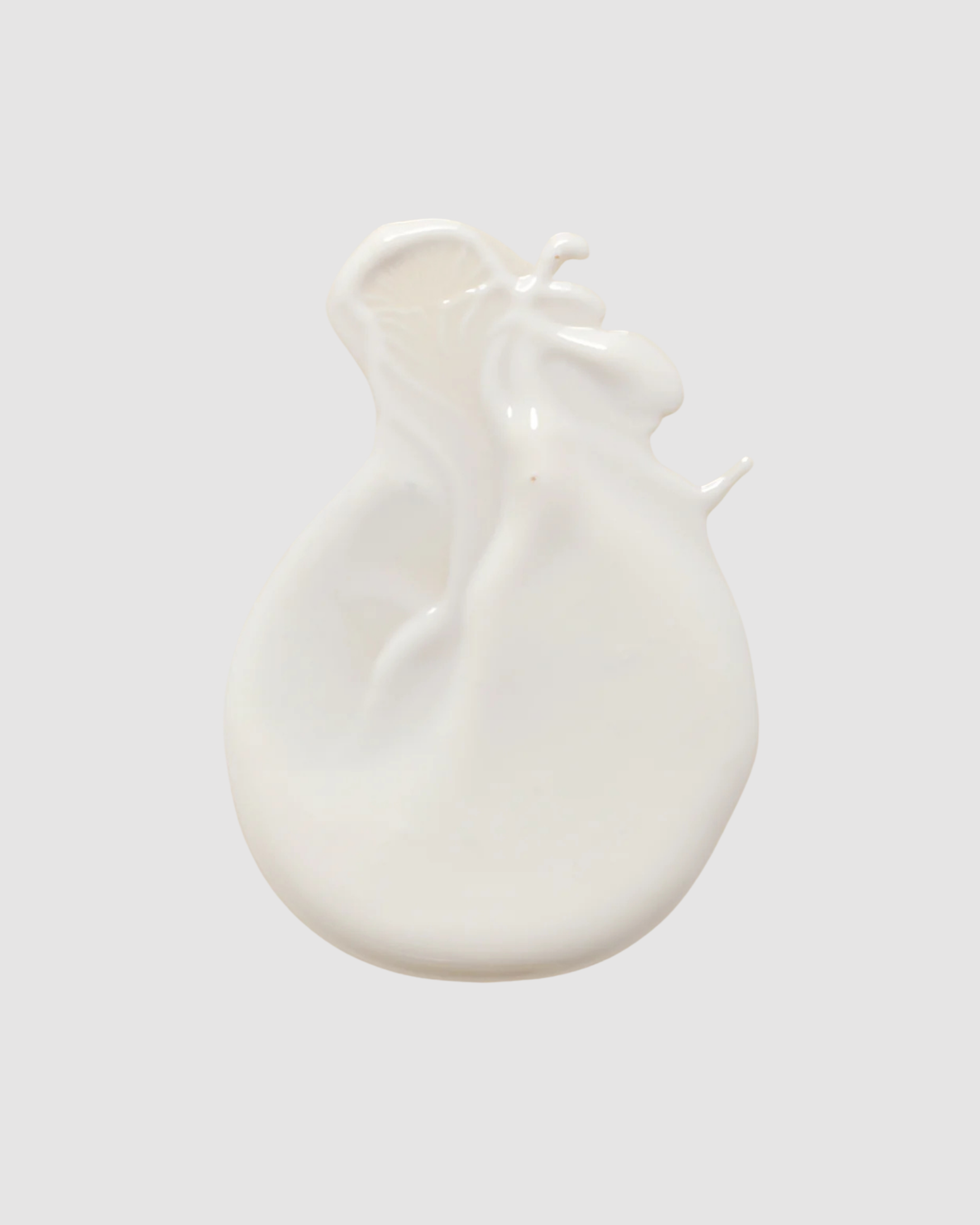 White LESSE SPF on a light gray background