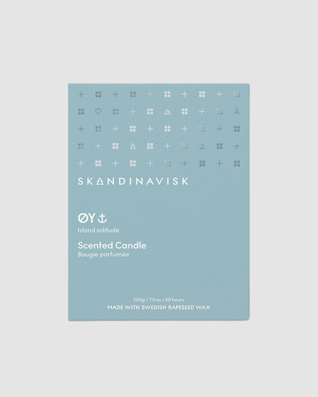 Skandinavisk scented candle packaging on a light gray background
