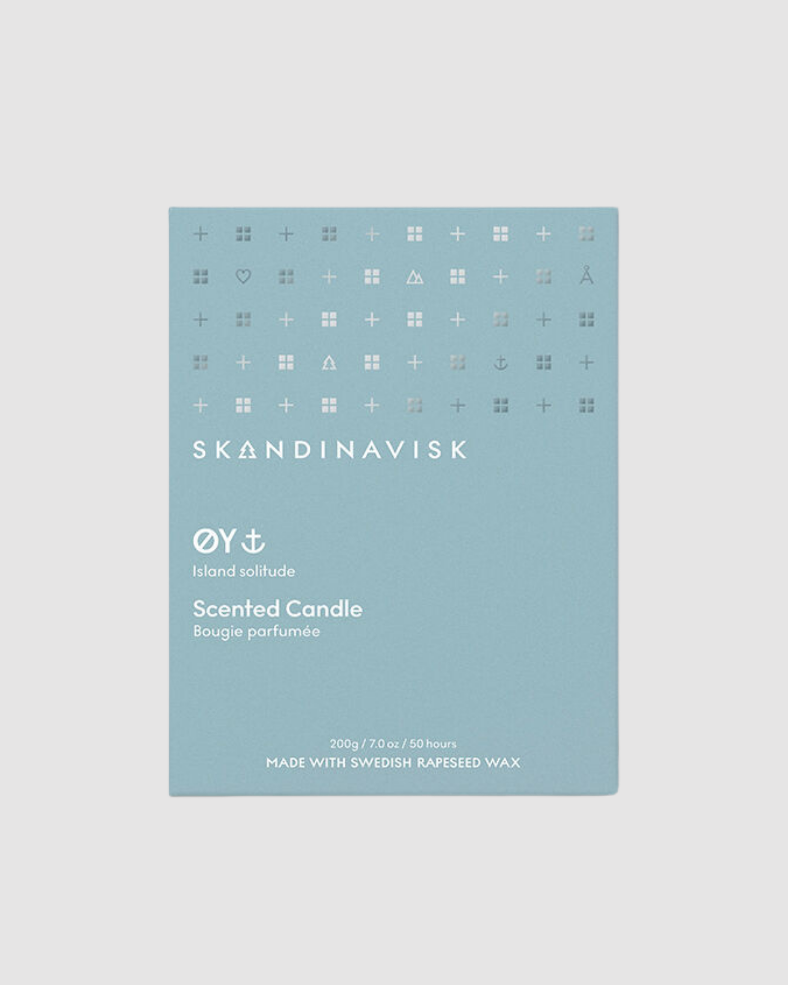 Skandinavisk scented candle packaging on a light gray background