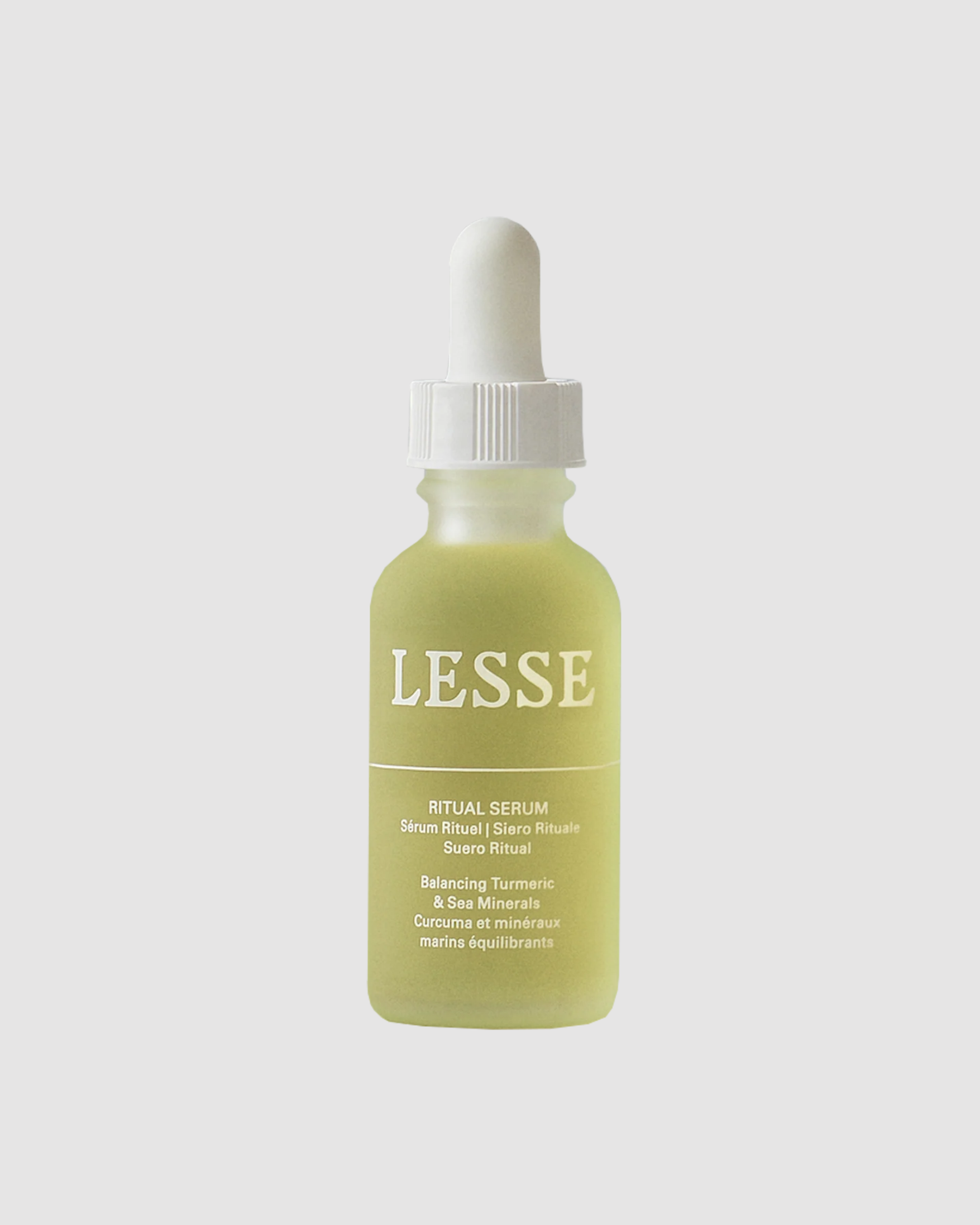 Skincare serum bottle with dropper labeled 'LESSE' on a light gray background
