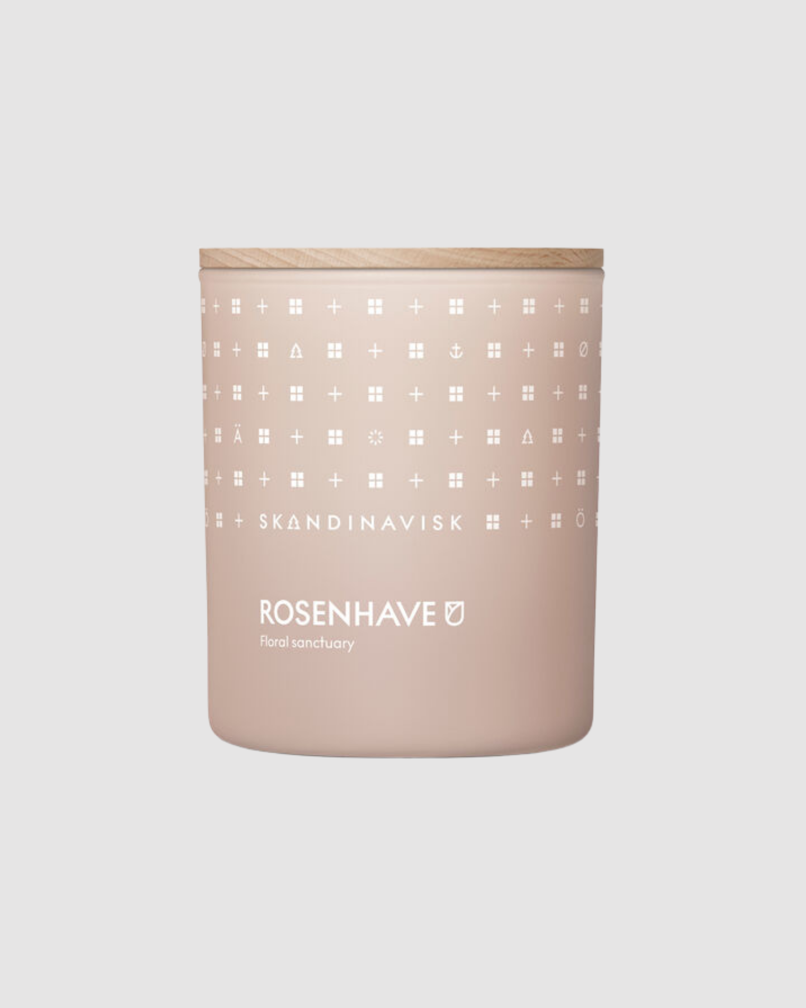 Candle with a patterned label on a light gray background