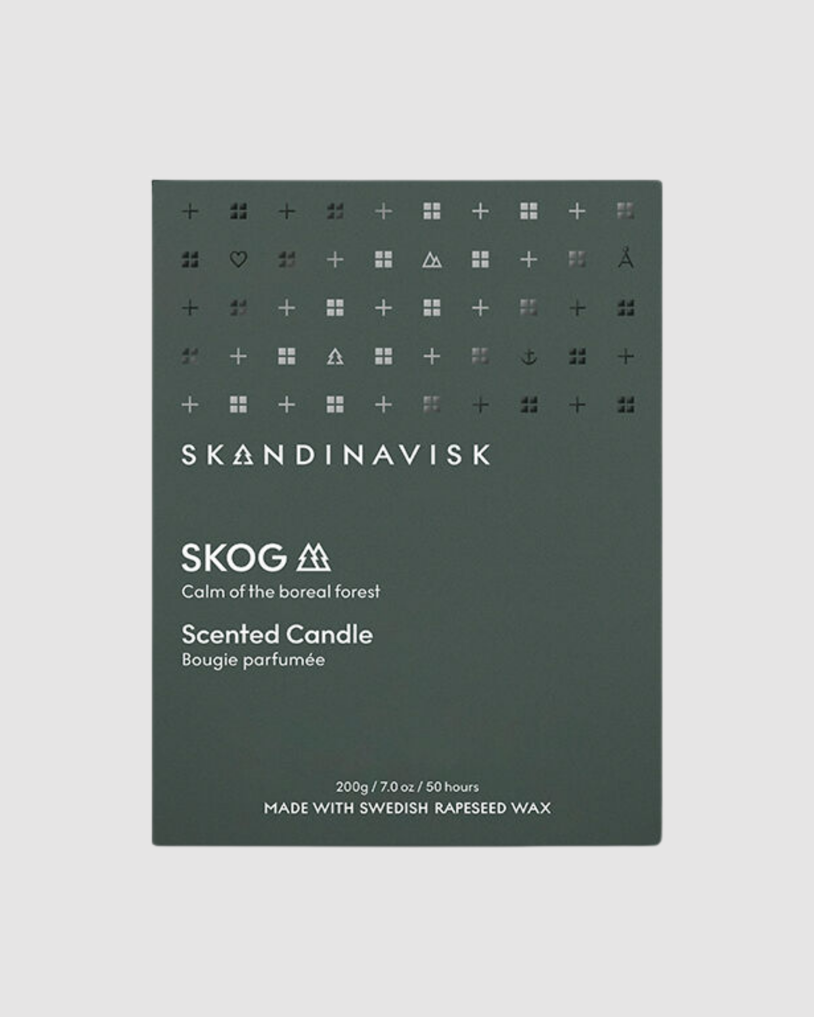 Skandinavisk Skog scented candle packaging on a light gray background
